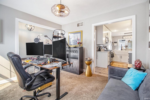 55705 Sichuan Dr, Osceola, IN 46561 - office featuring light carpet, a chandelier, and baseboards