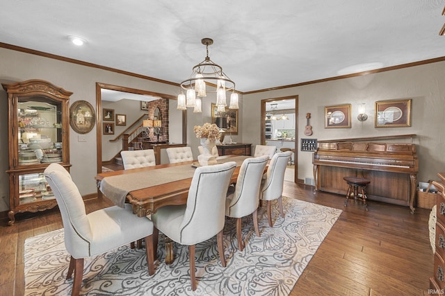 1365 W 15th St, Jasper, IN 47546 - dining room with stairs, hardwood / wood-style flooring, a chandelier, crown molding, and baseboards
