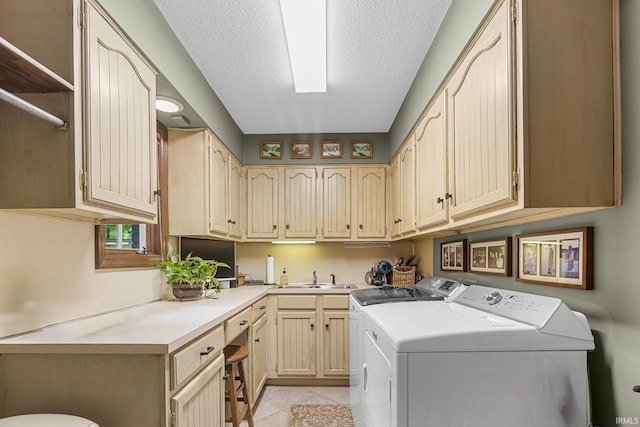 1365 W 15th St, Jasper, IN 47546 - washroom featuring independent washer and dryer, light tile patterned floors, a textured ceiling, and cabinet space