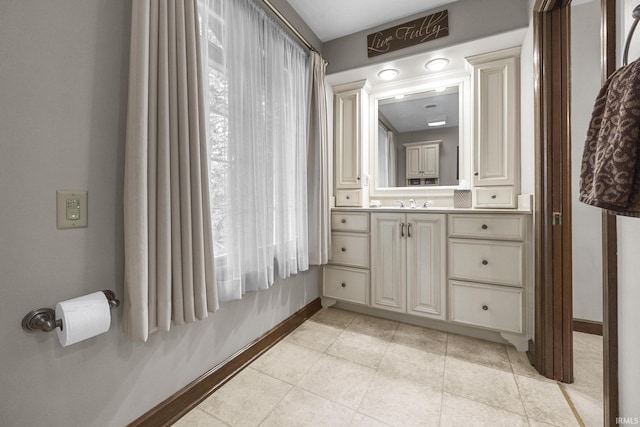 1365 W 15th St, Jasper, IN 47546 - bathroom with baseboards, vanity, and tile patterned floors