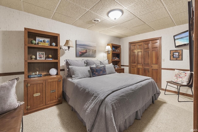 1365 W 15th St, Jasper, IN 47546 - bedroom featuring a paneled ceiling, light colored carpet, a closet, and a textured wall