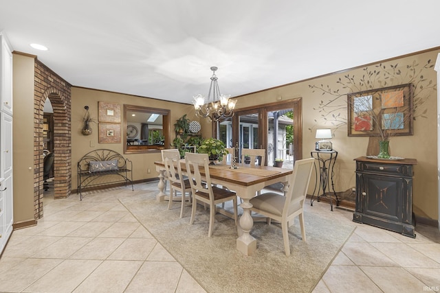 1365 W 15th St, Jasper, IN 47546 - dining area featuring light tile patterned floors, a chandelier, baseboards, and ornamental molding
