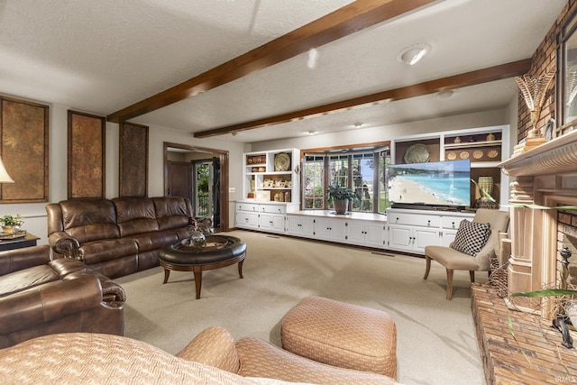 1365 W 15th St, Jasper, IN 47546 - living room with carpet, beam ceiling, a textured ceiling, and a fireplace with raised hearth