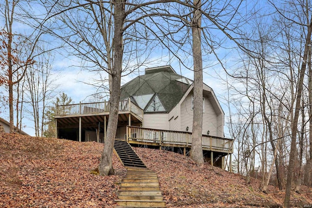 6655 Gopher Dr, Nineveh, IN 46164 - back of property featuring a deck, a shingled roof, and stairs
