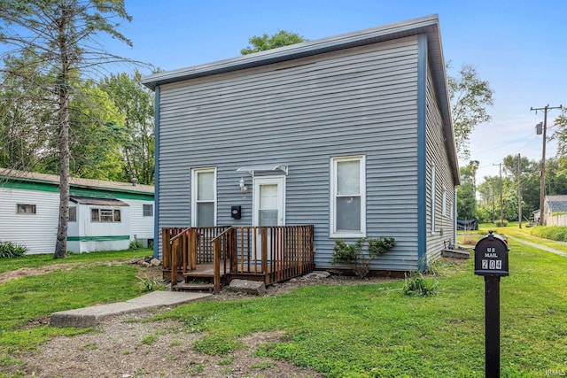 204 N W St, Attica, IN 47918 - rear view of property featuring a lawn