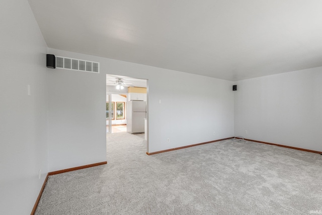 4294 E Defreese Rd, Syracuse, IN 46567 - empty room with light carpet, baseboards, and a ceiling fan