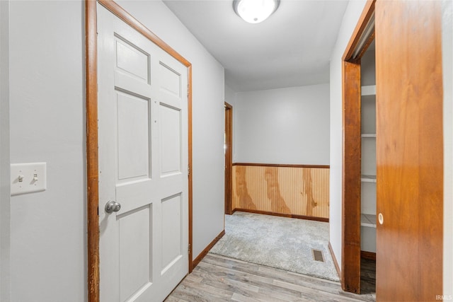 4294 E Defreese Rd, Syracuse, IN 46567 - hallway with wood finished floors, wainscoting, wood walls, and baseboards