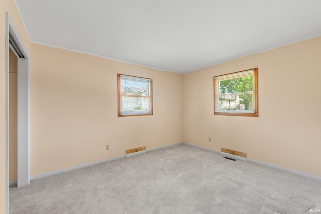 4294 E Defreese Rd, Syracuse, IN 46567 - empty room featuring light carpet and baseboards