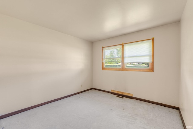 4294 E Defreese Rd, Syracuse, IN 46567 - spare room featuring light carpet and baseboards