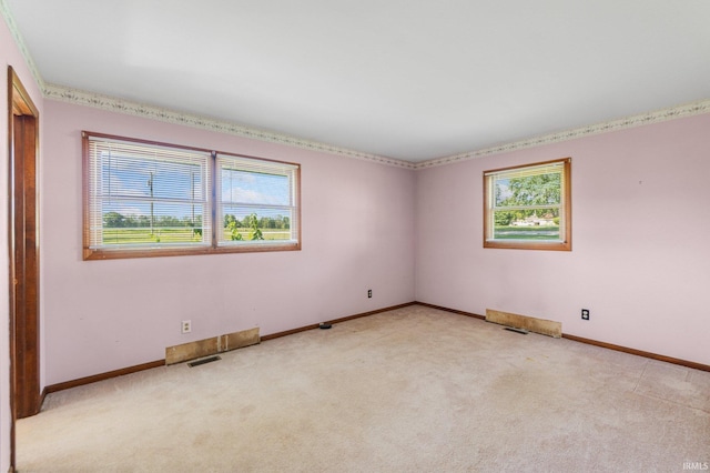 4294 E Defreese Rd, Syracuse, IN 46567 - empty room featuring healthy amount of natural light, light colored carpet, and baseboards