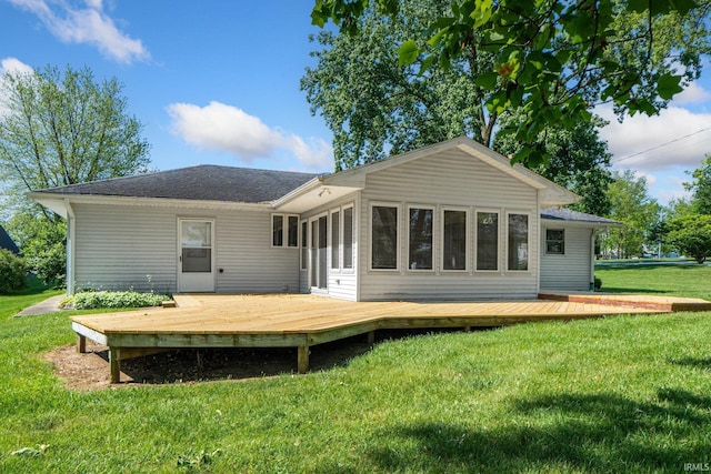 4294 E Defreese Rd, Syracuse, IN 46567 - rear view of property with a deck, a lawn, and a shingled roof