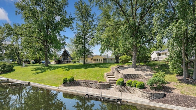 4294 E Defreese Rd, Syracuse, IN 46567 - dock featuring a water view and a lawn