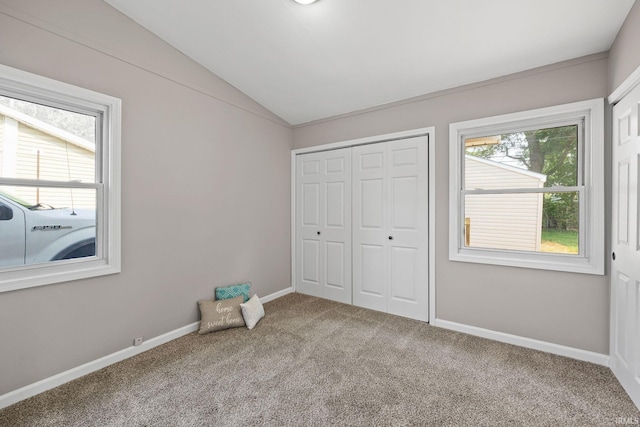 1008 Beck Ln, Lafayette, IN 47909 - unfurnished bedroom featuring vaulted ceiling, carpet flooring, a closet, baseboards, and washer / dryer