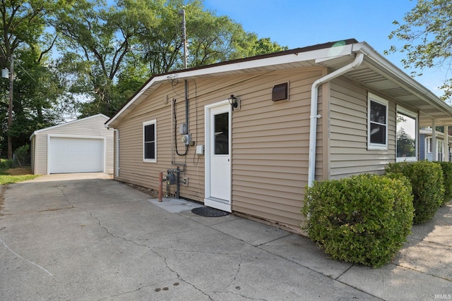 1008 Beck Ln, Lafayette, IN 47909 - view of side of property featuring an outbuilding, a garage, and concrete driveway