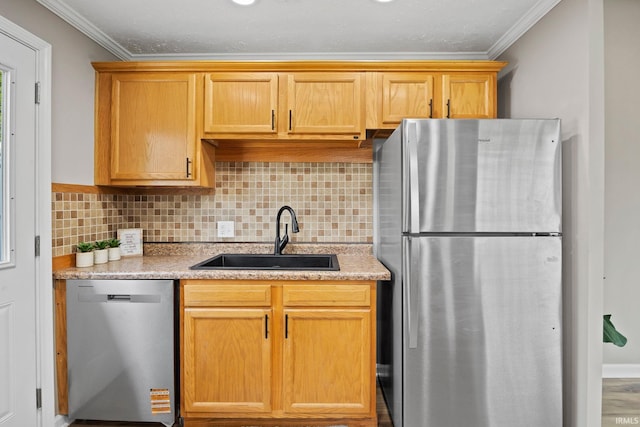 1008 Beck Ln, Lafayette, IN 47909 - kitchen with appliances with stainless steel finishes, a sink, crown molding, decorative backsplash, and light stone counters