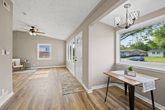 1008 Beck Ln, Lafayette, IN 47909 - entryway with lofted ceiling, wood finished floors, a chandelier, a ceiling fan, and baseboards