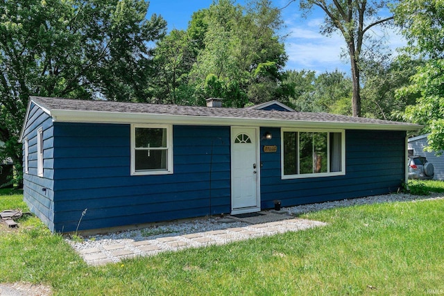 17016 Ruthie Ave, South Bend, IN 46635 - view of front of house with a front yard and a chimney