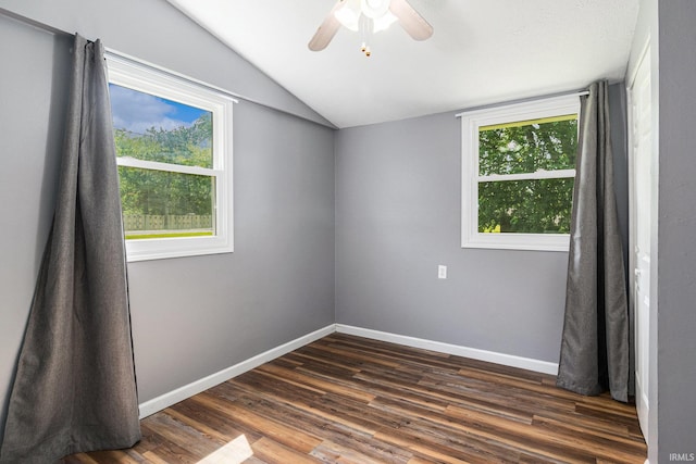 17016 Ruthie Ave, South Bend, IN 46635 - empty room with lofted ceiling, baseboards, dark wood-type flooring, and a ceiling fan