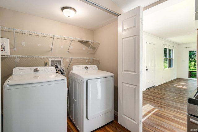 17016 Ruthie Ave, South Bend, IN 46635 - laundry area featuring separate washer and dryer and wood finished floors