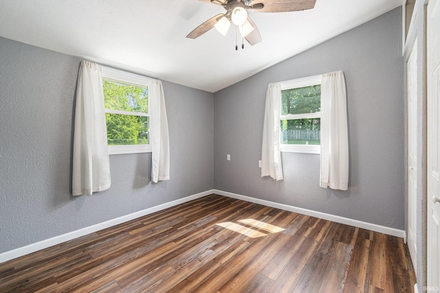 17016 Ruthie Ave, South Bend, IN 46635 - spare room with lofted ceiling, healthy amount of natural light, dark wood-style floors, baseboards, and ceiling fan