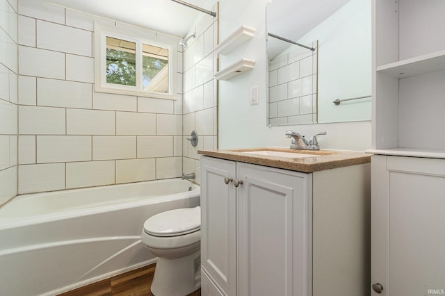 17016 Ruthie Ave, South Bend, IN 46635 - full bath featuring toilet, vanity, tub / shower combination, and wood finished floors
