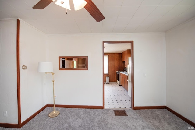 2331 N 24th St, Lafayette, IN 47904 - spare room with light colored carpet, crown molding, baseboards, and ceiling fan