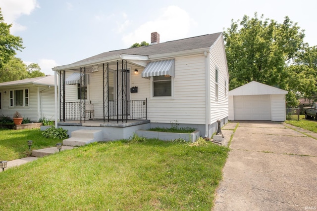 2331 N 24th St, Lafayette, IN 47904 - view of front of home with a front yard, a chimney, an outbuilding, and a detached garage