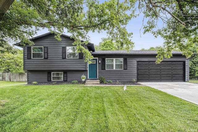 61156 Old Spanish Trl, South Bend, IN 46614 - tri-level home with a garage, driveway, and entry steps