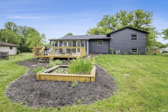 61156 Old Spanish Trl, South Bend, IN 46614 - rear view of house featuring a sunroom, a wooden deck, and central AC