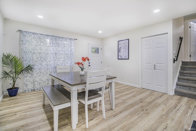 61156 Old Spanish Trl, South Bend, IN 46614 - dining area featuring light wood-style floors, stairway, baseboards, and recessed lighting
