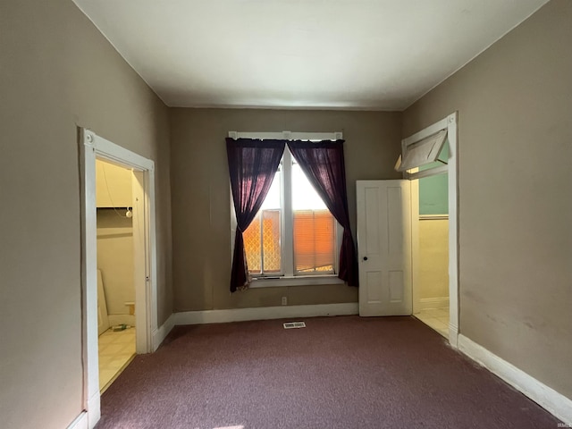 607 N 10th St, Vincennes, IN 47591 - unfurnished bedroom featuring carpet flooring, baseboards, and ensuite bath