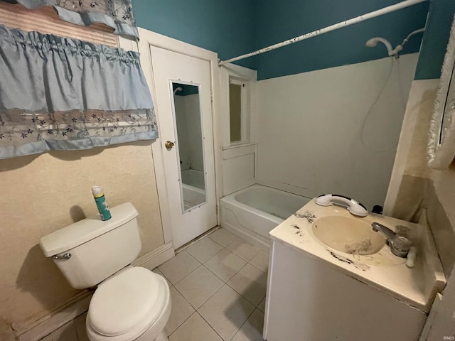 607 N 10th St, Vincennes, IN 47591 - full bathroom featuring toilet, tile patterned flooring, vanity, and tub / shower combination