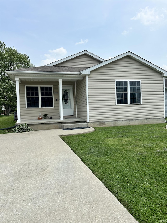 1406 Hillcrest Rd, Bedford, IN 47421 - view of front of property with a front yard, a porch, roof with shingles, crawl space, and central air condition unit
