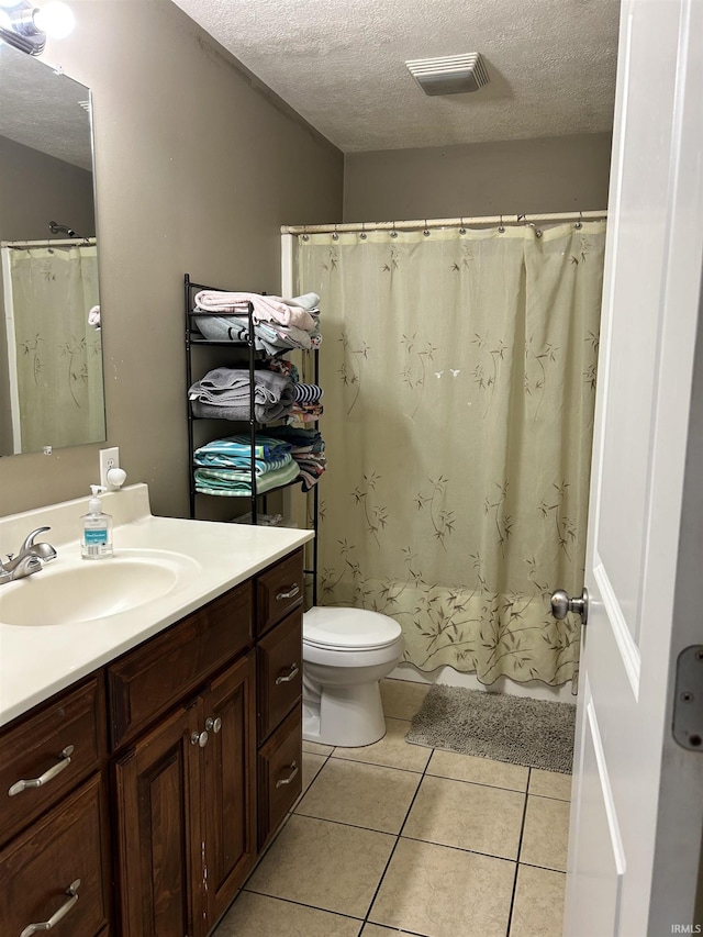 1406 Hillcrest Rd, Bedford, IN 47421 - bathroom featuring a textured ceiling, vanity, toilet, tile patterned floors, and curtained shower