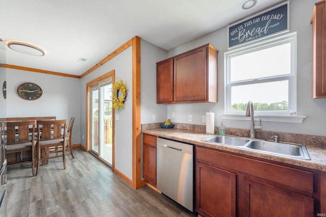 303 Shrack Ln, Dunkirk, IN 47336 - kitchen with stainless steel dishwasher, a sink, light wood finished floors, brown cabinets, and baseboards