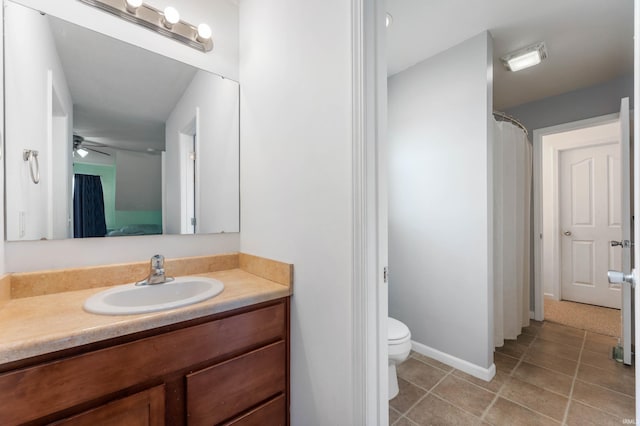 303 Shrack Ln, Dunkirk, IN 47336 - ensuite bathroom featuring vanity, tile patterned floors, toilet, ceiling fan, and baseboards