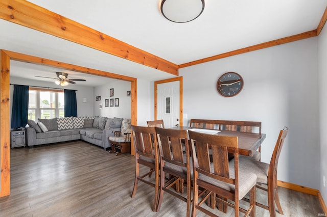 303 Shrack Ln, Dunkirk, IN 47336 - dining room with wood finished floors, a ceiling fan, and baseboards