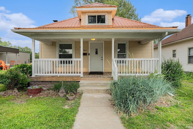 407 N Front St, North Manchester, IN 46962 - bungalow-style home with a porch and metal roof