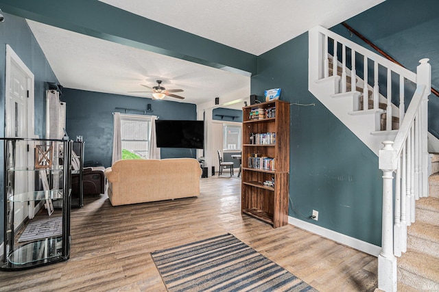 407 N Front St, North Manchester, IN 46962 - living room featuring stairs, a ceiling fan, wood finished floors, and baseboards
