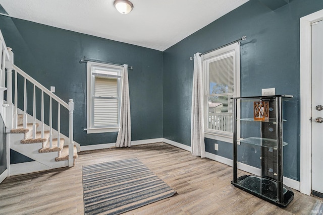 407 N Front St, North Manchester, IN 46962 - entrance foyer with wood finished floors, baseboards, and stairway
