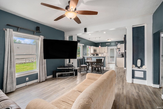 407 N Front St, North Manchester, IN 46962 - living room with light wood-type flooring, ceiling fan, and baseboards