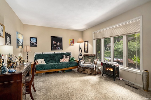 17411 Woodhurst Rd, Granger, IN 46530 - living area featuring carpet flooring and a wood stove