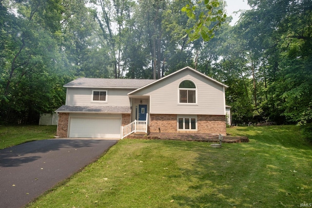 1153 N Diamond Point Ct, Monticello, IN 47960 - split foyer home with brick siding, driveway, a front yard, and a garage