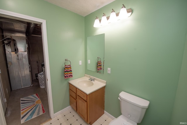 1153 N Diamond Point Ct, Monticello, IN 47960 - bathroom featuring vanity, toilet, baseboards, and tile patterned floors