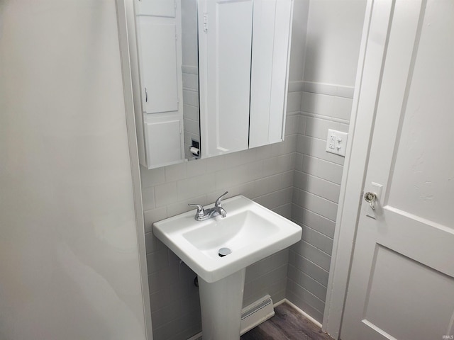 1005 E 4th St, Mishawaka, IN 46544 - bathroom featuring tile walls and wood finished floors