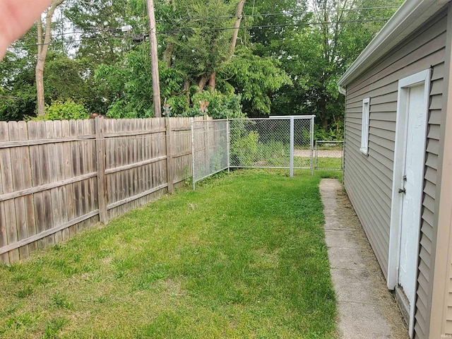 1005 E 4th St, Mishawaka, IN 46544 - view of yard with view of wooded area and a gate