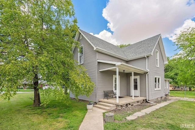 8060 W 900 S, Fairmount, IN 46928 - view of front of house featuring a shingled roof, a front lawn, and covered porch