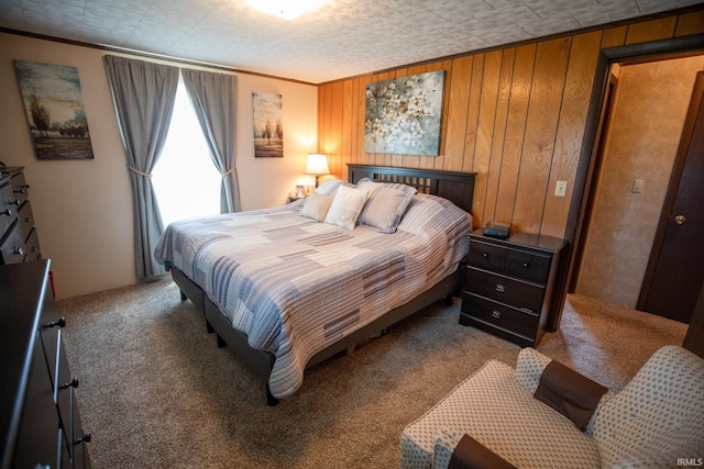 12350 Cedar Rd, Bourbon, IN 46504 - bedroom featuring carpet floors, wooden walls, and ornamental molding