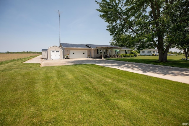 12350 Cedar Rd, Bourbon, IN 46504 - ranch-style house featuring driveway, a garage, and a front lawn