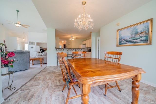 1843 Valley View Dr, Kokomo, IN 46902 - dining room with a ceiling fan, a chandelier, and light stone finish floors